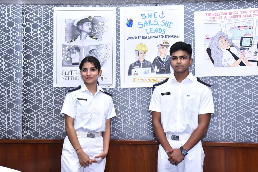 Cadets beside a display of maritime artwork. ANCHOR archive.